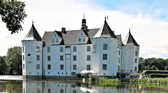 White castle in Flensburg located at the waterfront.