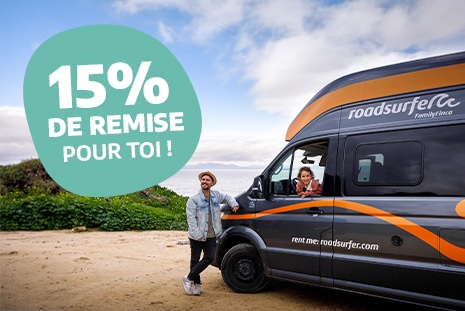 Couple next to a family finca near the sea