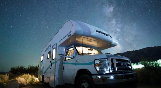 roadsurfer RV under the Milky Way at Joshua Tree National Park—fun things to do in California with kids.