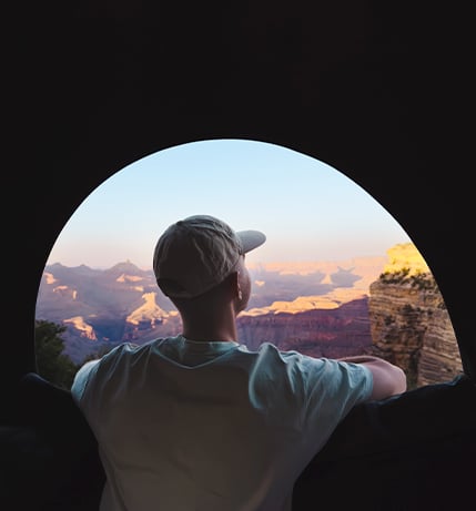 Man Looking At A Scenic Mountain View