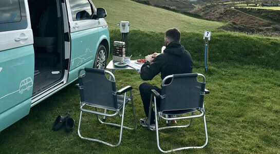 Man prepared camping meal parked in the countryside