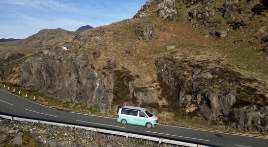 VW campervan driving along the roads in Wales
