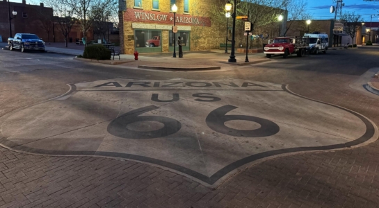 A large route 66 marker on a road