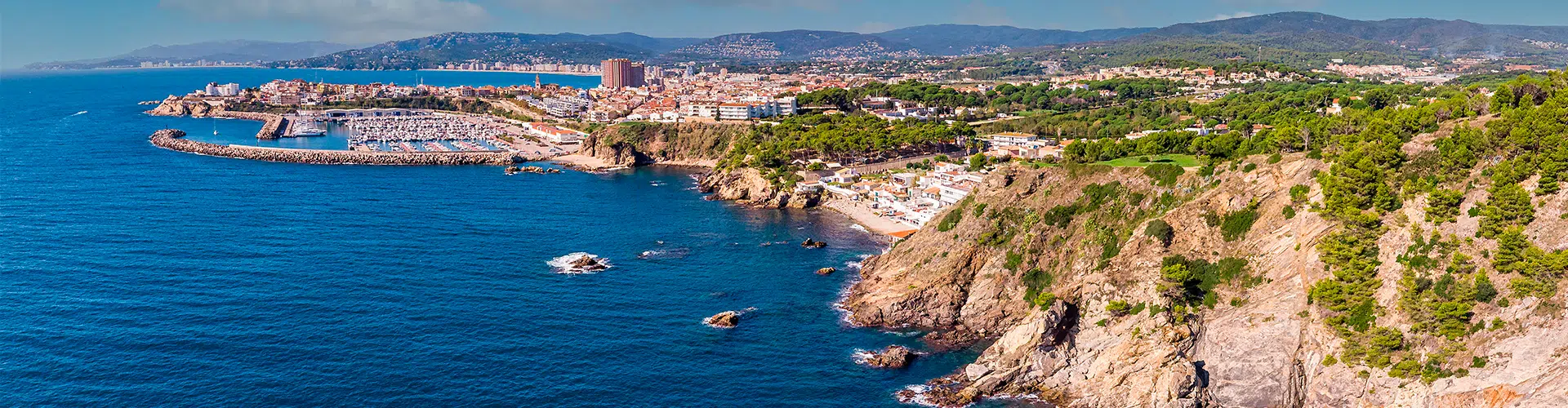 Aerial view of the coast of Palamós and its port in the Costa Brava.