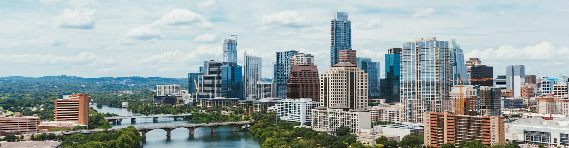 Aerial view of Downtown Austin in Texas with modern skycrapers and the river.