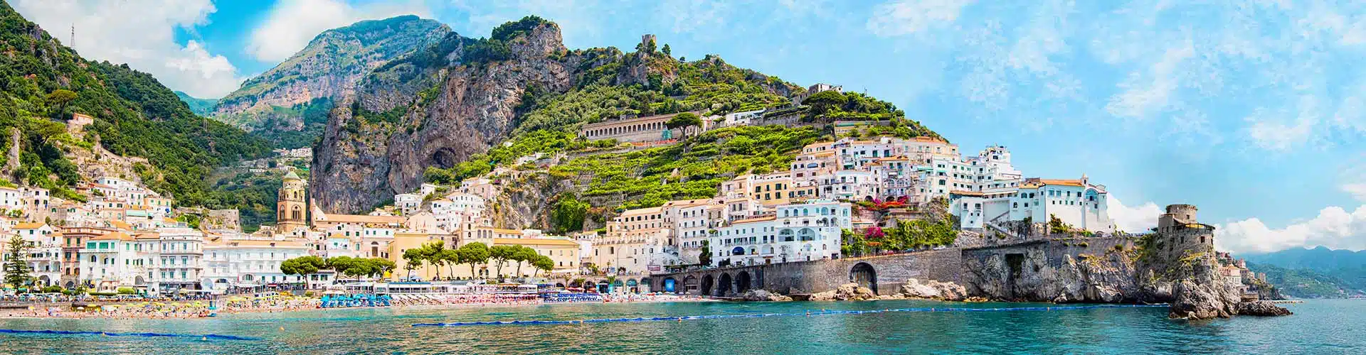 Panorama view of Amalfi Coast village in Italy with tiny beach and colorful houses on the hillside