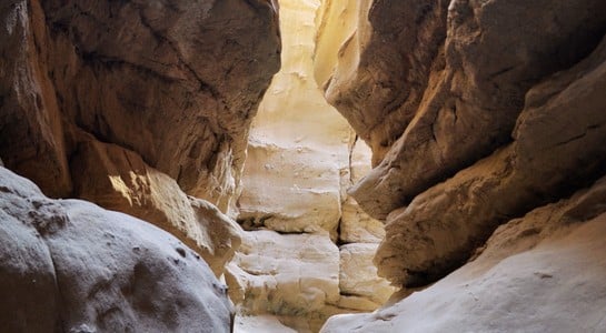 Narrow sandstone slot canyon with light from above—a cheap thing to do with kids in California.