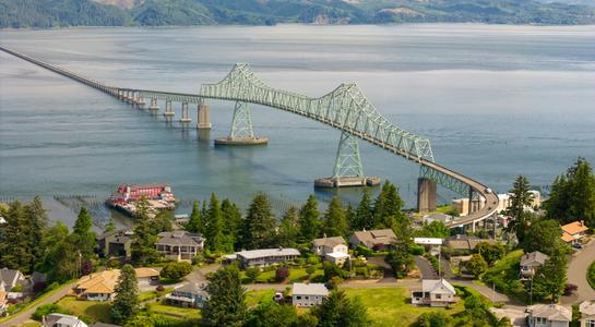 Aerial view of the Astoria-Megler Bridge spanning the Columbia River between Oregon and Washington.