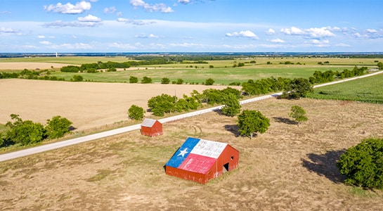 Red barn located on a field in Texas.