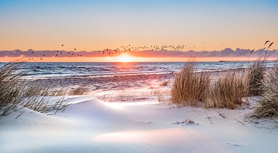 Sunset at at the Baltic Sea at a beach in Denmark.