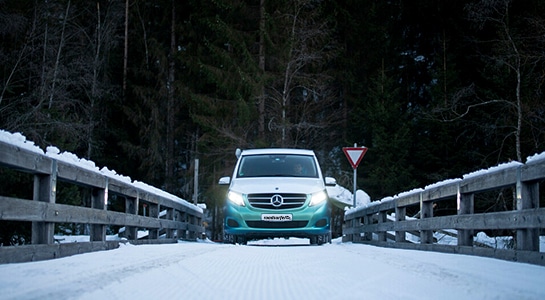 Mercedes Marco Polo driving over a snowy bridge