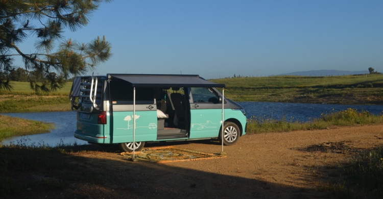 campervan with owning opened near a lake in costa vicentina
