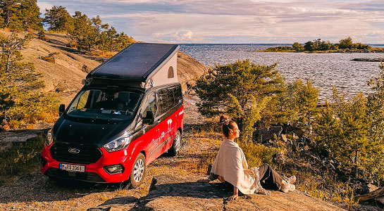 ford nugget camper parking at a lovely swedish coast spot