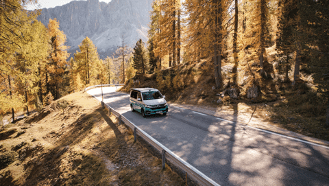 Camper driving on the road in the mountains