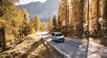 Camper driving on the road in the mountains