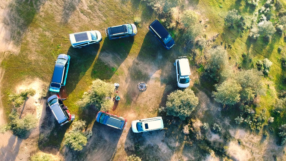 Campervans standing in a circle in a field