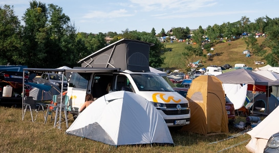 Campervan festival with roadsurfer camper van
