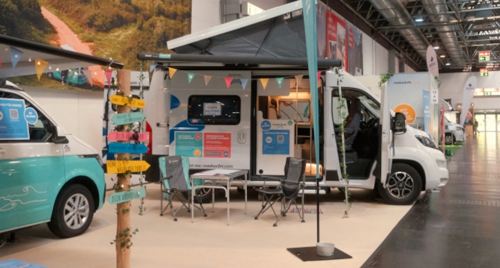 Campervans parked in a fair hall