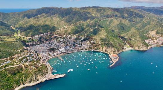 Aerial view of Avalon Harbor on Catalina Island, showcasing one of the most unique offshore beaches in LA.