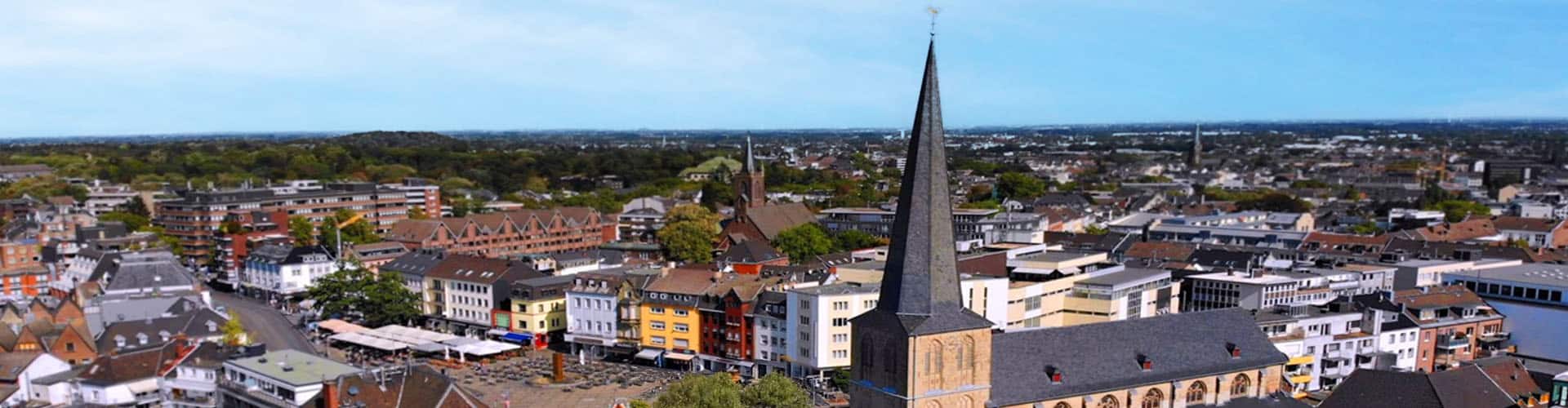 City view of Mönchengladbach from above with the church tower visible in the foreground.