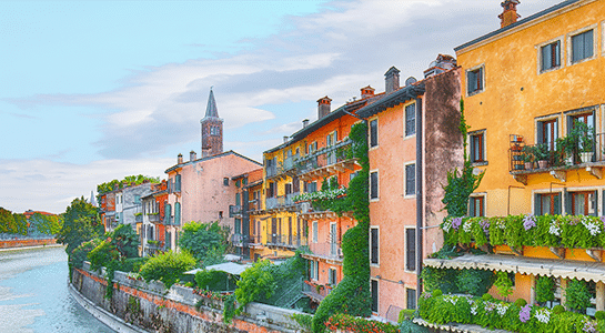 Colorful houses in Verona built alongside the river