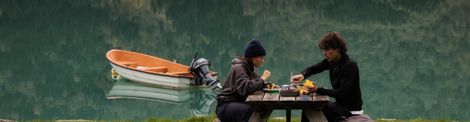 Couple eating by the lake.