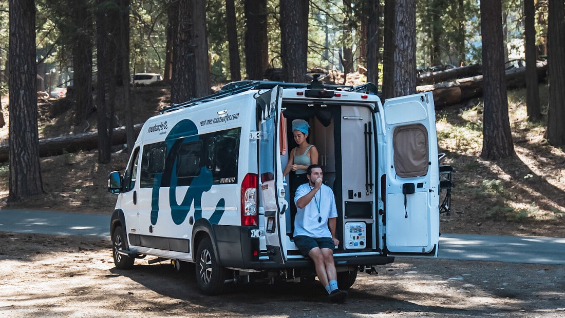 couple gets ready for the day in a motorhome