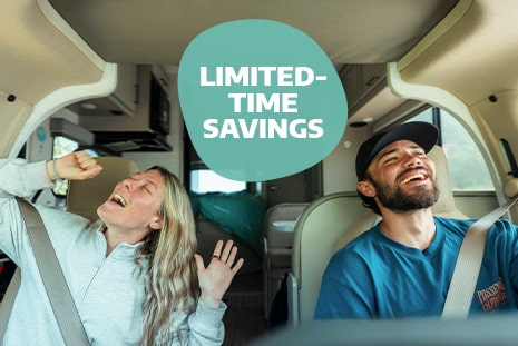 Couple Singing In Camper Van