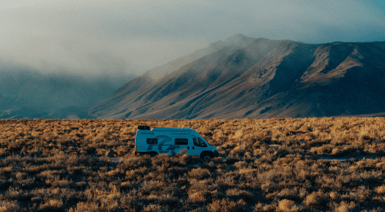 RV traveling through Death Valley desert terrain, highlighting why the best RV size for national parks balances access and mobility