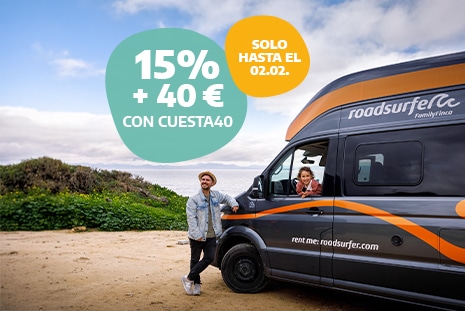 Early Bird father and daughter with campervan enjoying the views during a roadtrip