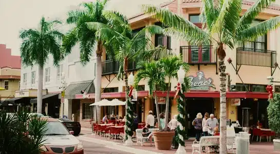 Outdoor cafés and palm-lined Mediterranean buildings along Española Way in Miami Beach, Florida