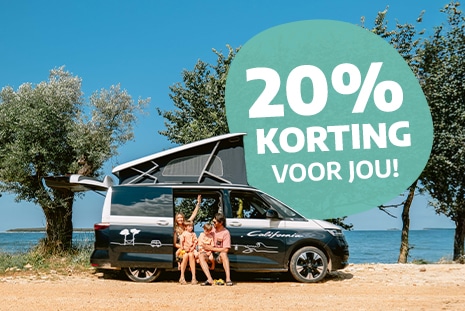 Family of four sitting in the doorway of a campervan