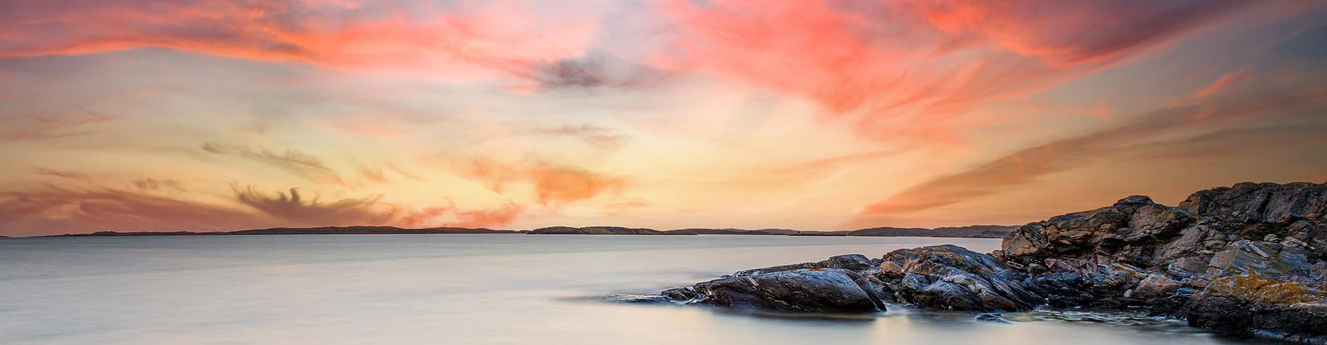 Gothenburg, Sweden rocky coastline by the water at sunset