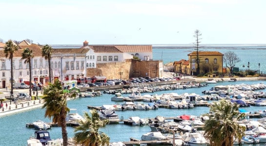 View in the harbour of Faro with small ships on a sunny day