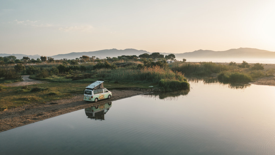 roadsurfer campervan near a lake in italy