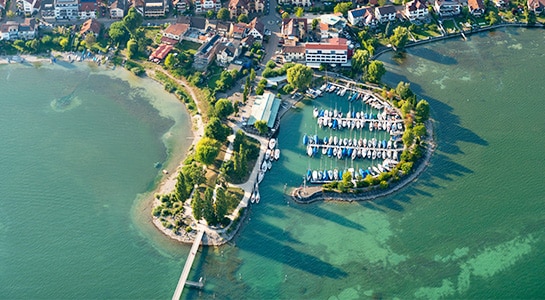 Bird view of Lake Constance in Immenstadt, Germany showing the lake and parts of the city.