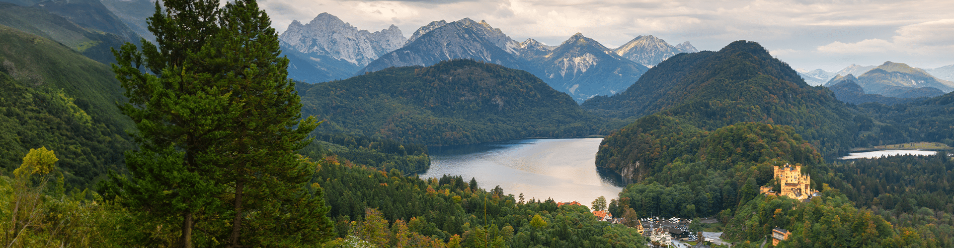 Bird view over the Forggensee close to Füssen that is embedded in between hills and mountains
