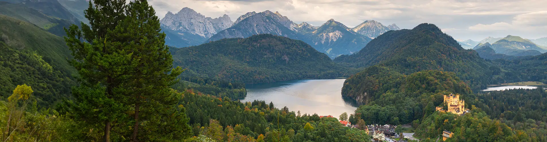 Bird view over the Forggensee close to Füssen that is embedded in between hills and mountains