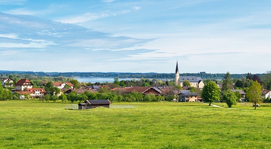 Landscape view over Bernau am Chiemsee in Germany, overlooking parts of the city and lake.