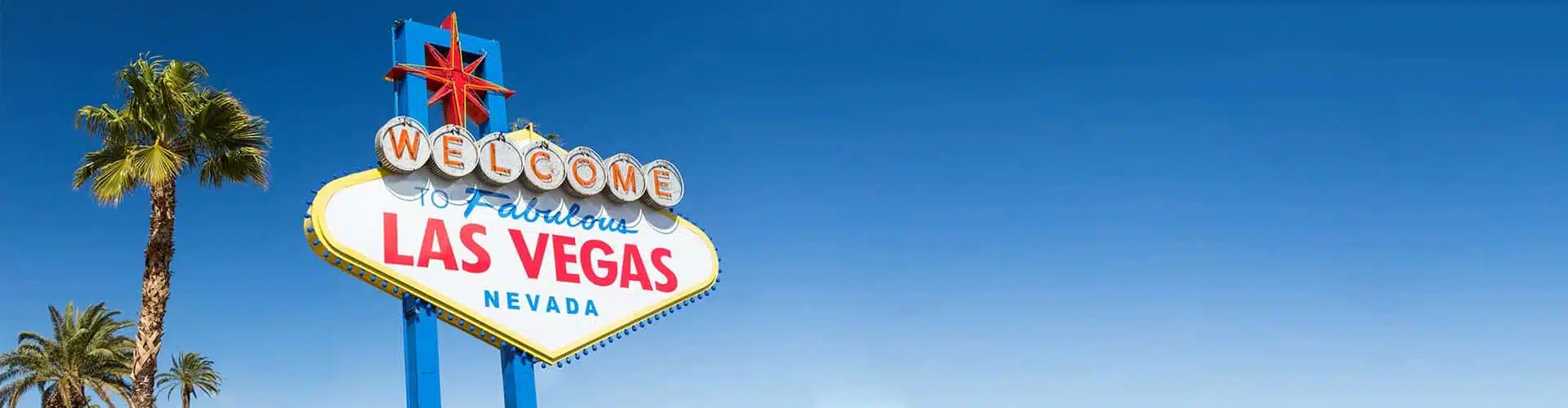 Las Vegas sign in USA with Palmtree and blue sky