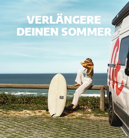 Late summer roadsurfer promotion with girl sitting next to sprinter campervan and surfboard near the beach