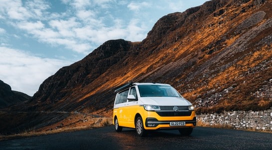 RV parked in a dramatic Highland valley on a Scotland road trip through Loch Tay and Perthshire.”