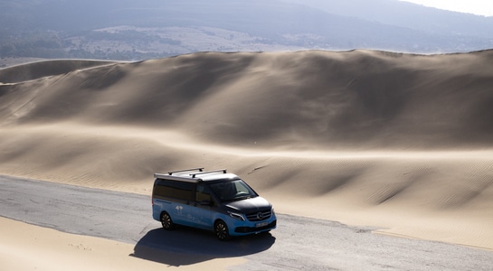 Mercedes Marco Polo driving on a road through dunes in the south of Spain in Andalusia