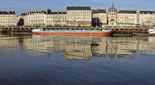 nantes waterfront with boat on the water