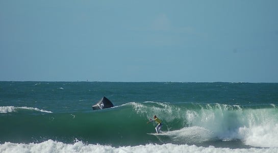 Surfer dropping into a heavy wave at Ocean Beach San Francisco