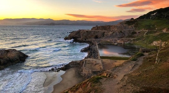 Sutro Baths ruins at sunset overlooking Ocean Beach San Francisco, one of the best surfing spots in California