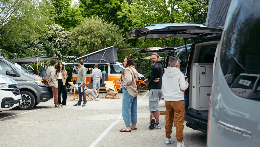 people checking different campervas on a deal day