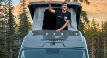 Pop up camper van with roof sleeping area in the mountains