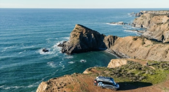 A roadsurfer campervan staying at a cliff ant to Algarve coast in Portugal