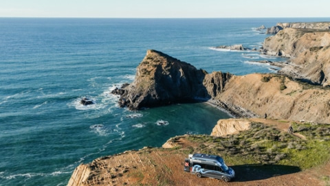 A roadsurfer campervan staying at a cliff ant to Algarve coast in Portugal